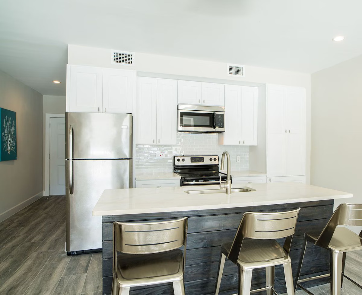 Pool view with den kitchen